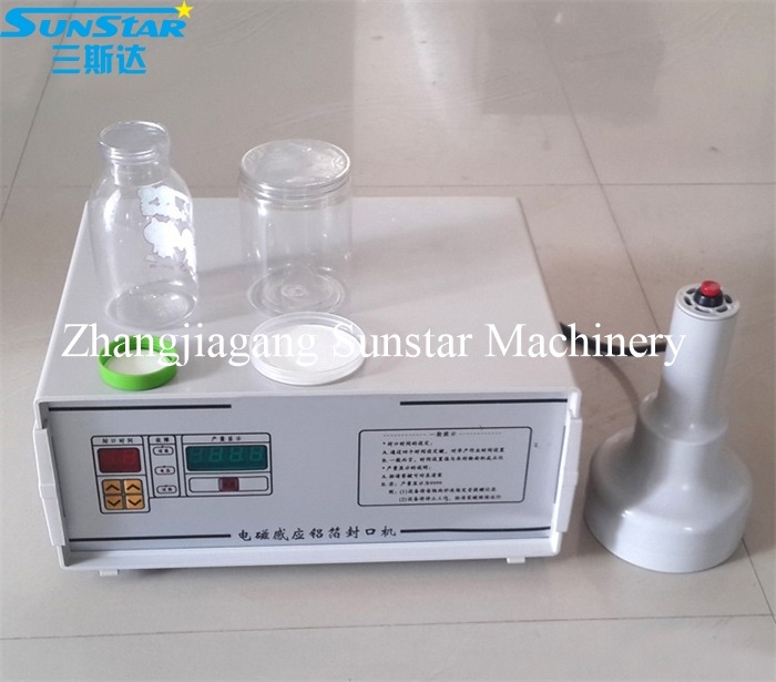 Portable hand operated electromagnetic induction sealing machine