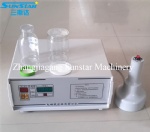 Portable hand operated electromagnetic induction sealing machine